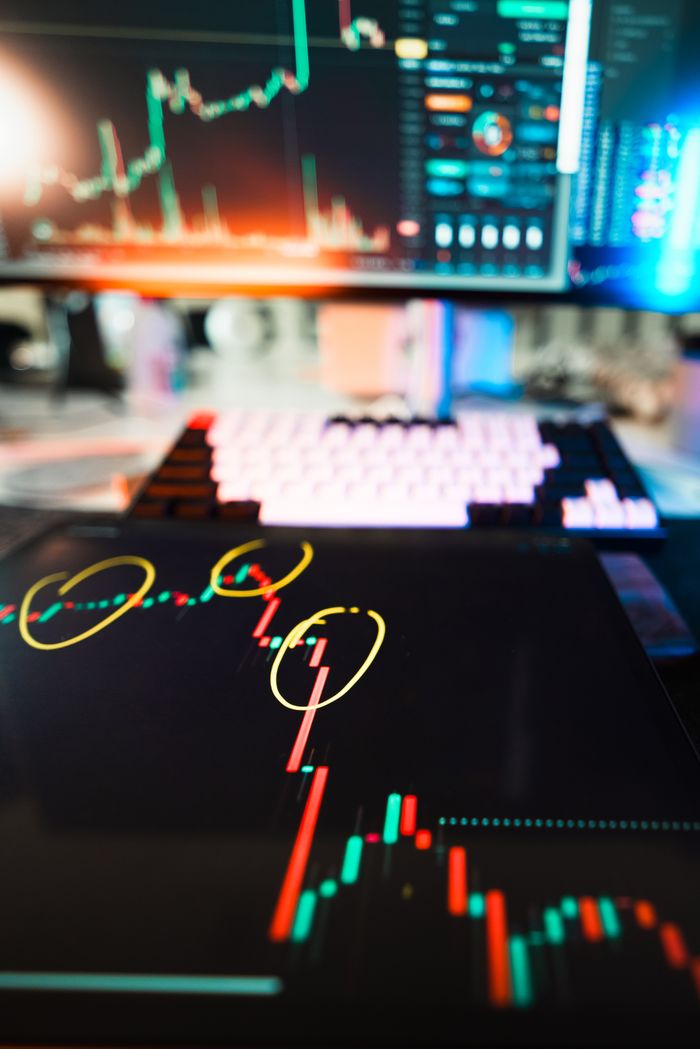 project-01-c Close-up of cryptocurrency market data visualization on screens with highlighted trends and charts.